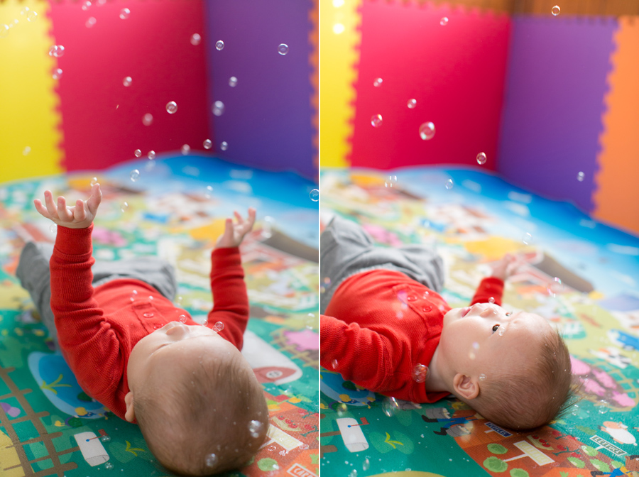 baby playing with bubbles