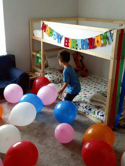 Nolan on the morning of his 2nd birthday. Balloon madness!